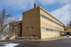 Building Exterior (west side and SW corner of 5th Avenue extension with Central Family Center sign on building)