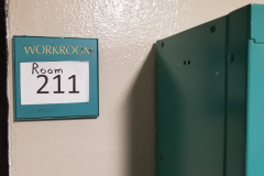 211 Room Number Sign on north wall of 2nd Floor Hallway